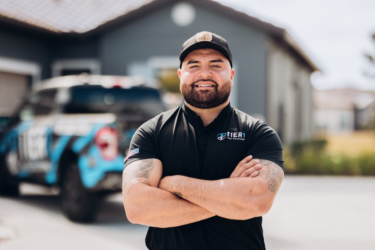 Tier 1 Pest Solutions owner with branded truck